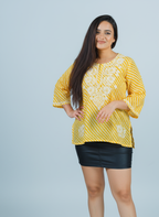 Yellow Chikankari Kurti showcasing intricate hand embroidery on soft Mulmul fabric.